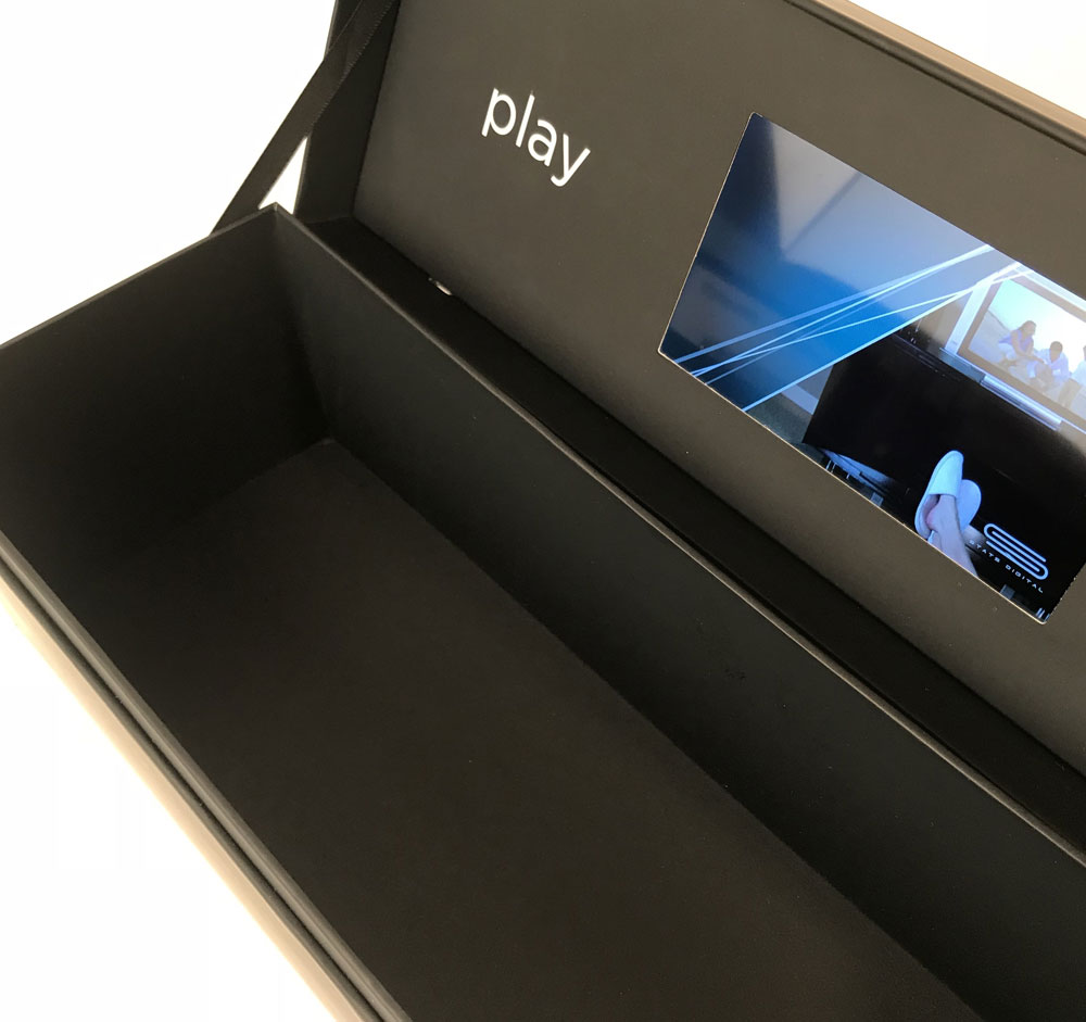 wine bottle video box features black ribbons